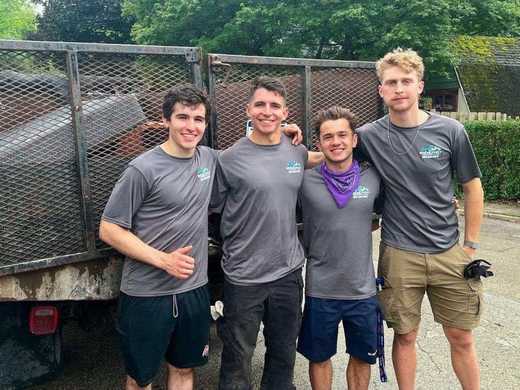 Four Breakaway crew members in front of their trailer