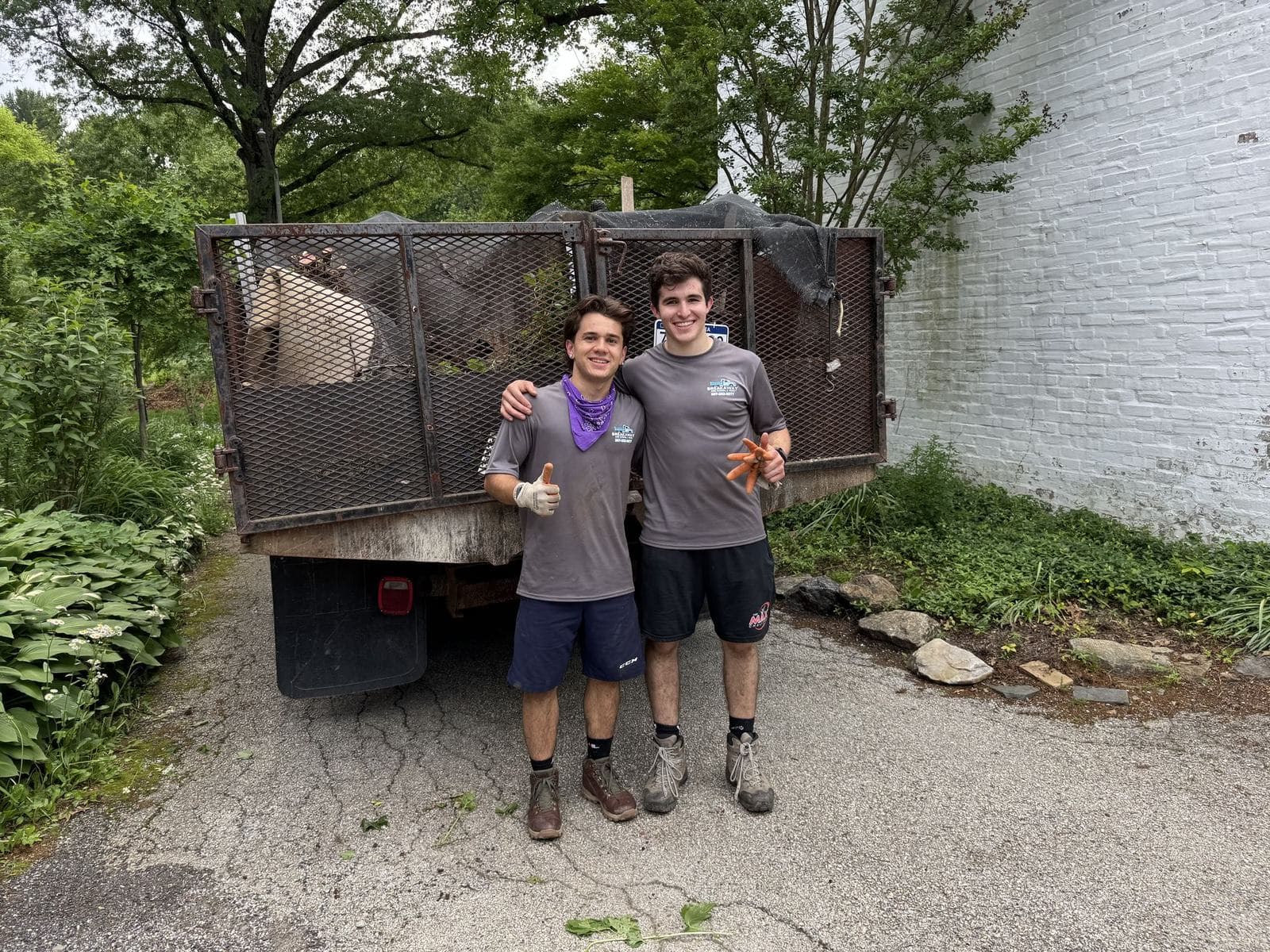 Two Breakaway crew members in front of a loaded trailer